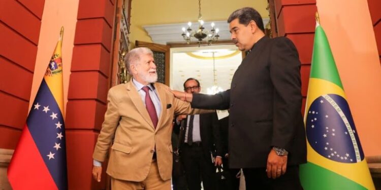 Venezuela's President Nicolas Maduro and Brazil's envoy Celso Amorim meet, in Caracas, Venezuela March 8, 2023. Marcelo Garcia Miraflores Palace Handout via REUTERS