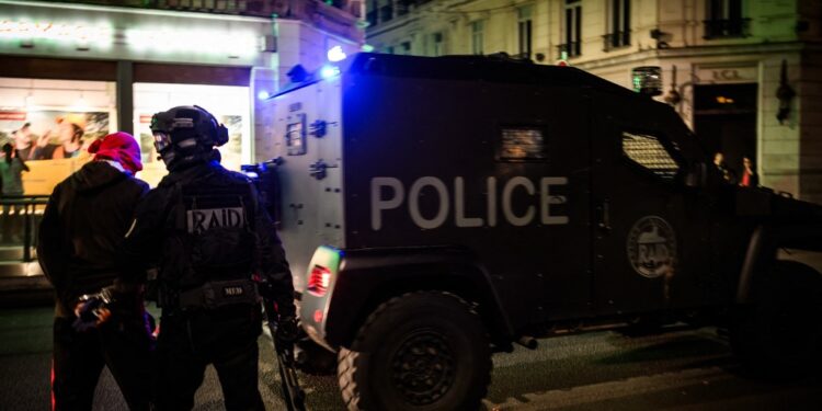 RAID policemen arrest a man during clashes with police the Lyon streets, on June 30, 2023, three days after a 17-year-old boy was shot in the chest by police at point-blank range in Nanterre, a western suburb of Paris. A third consecutive night of violence in France sparked by the killing of a teenager by a policeman during a traffic stop has left 249 police and gendarmes injured, the interior ministry announced on June 30. Nahel M., 17, was shot in the chest at point-blank range on the morning of June 27, 2023, in an incident that has reignited debate in France about police tactics long criticised by rights groups over the treatment of people in low-income suburbs, particularly ethnic minorities.
Jeff PACHOUD / AFP (Photo by JEFF PACHOUD / AFP)