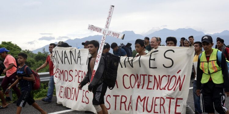 Migrants take part in a caravan towards the border with the United States in Huehuetan, Chiapas State, Mexico, on November 1, 2023. (Photo by ISAAC GUZMAN / AFP)