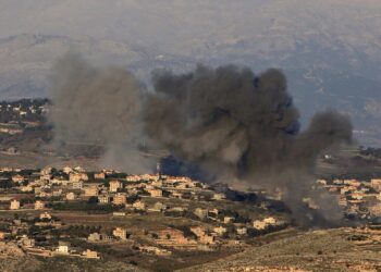 Smoke billows over the southern Lebanese village of Meiss El-Jabbal near the border with Israel following Israeli bombardment on December 26, 2023, amid ongoing cross-border tensions as fighting continues between Israel and Hamas militants in Gaza. (Photo by AFP)