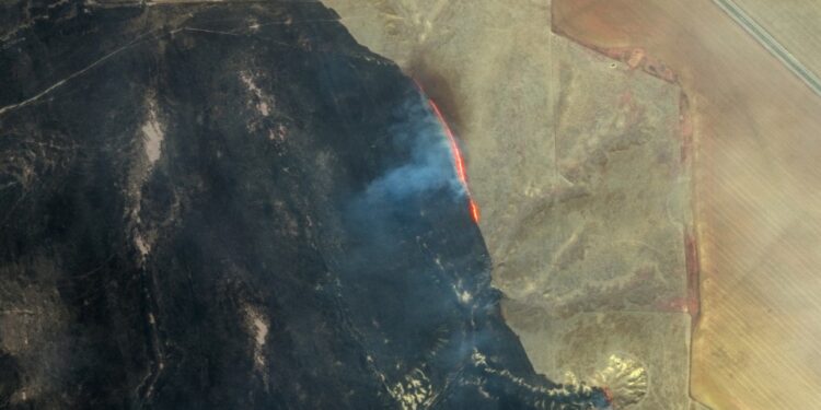 This handout satellite image released by Maxar Technologies shows the active fire line and burn scars northwest of Miami, Texas on February 28, 2024. Seven wildfires were raging in Texas, including one of the largest in recent state history, authorities said February 28, as properties were destroyed and multiple evacuation orders were issued, particularly in the north.
The Smokehouse Creek Fire in Texas' panhandle, a flat northern area known for its prairies and smattering of small towns, was listed as 3 percent contained by the Texas A&M Forest Service. (Photo by Satellite image ©2024 Maxar Technologies / AFP) / RESTRICTED TO EDITORIAL USE - MANDATORY CREDIT "AFP PHOTO/ SATELLITE IMAGE ©2024 MAXAR TECHNOLOGIES" - NO MARKETING NO ADVERTISING CAMPAIGNS - DISTRIBUTED AS A SERVICE TO CLIENTS - THE WATERMARK MAY NOT BE REMOVED/CROPPED