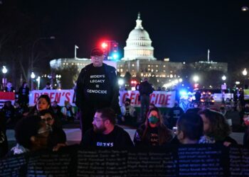 Pro-Palestinian demonstrators block a street during a protest ahead of US President Joe Biden's State of the Union address near the US Capitol in Washington, DC, on March 7, 2024. (Photo by PEDRO UGARTE / AFP)