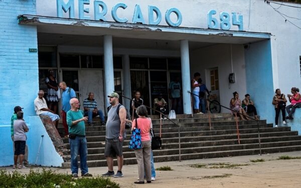 People queue to buy food in Havana on March 8, 2024. "What can I pay with here?" This is the question that Cubans ask when they enter a store, a restaurant or a gas station, on an island where four currencies and multiple exchange rates coexist. "That's tortuous, where am I going to buy, how is the exchange rate, if it's convenient for me to change it," Pedro Gonzalez, an overwhelmed 68-year-old engineer who retired in 2020, told AFP, but returned to work seven months later, after seeing that his money "evaporated like water." (Photo by YAMIL LAGE / AFP)