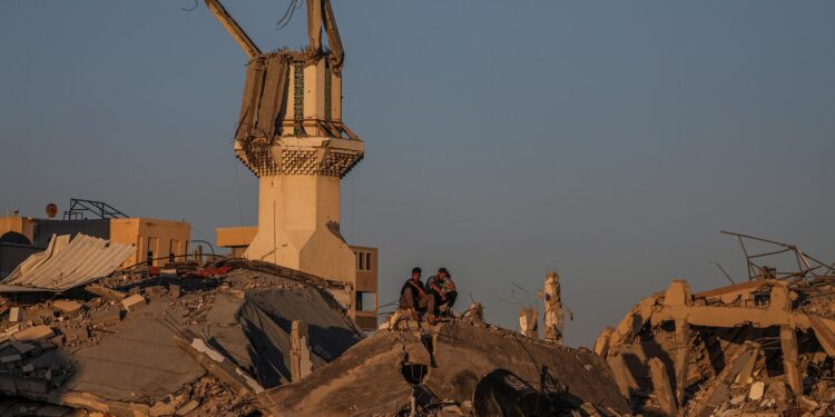 Gaza (---), 06/05/2024.- Palestinians sit among the rubble of a destroyed house along Salah Al Din road between Rafah and Khan Younis town, southern Gaza Strip, 06 May 2024 (issued 07 May 2024). The Israel Defence Forces (IDF) on 06 May called on residents of eastern Rafah to 'temporarily' evacuate. On 07 May the IDF confirmed that its ground troops began an overnight operation targeting Hamas militants and infrastructure within specific areas of eastern Rafah, taking operational control of the Gazan side of the Rafah crossing based on intelligence information. More than 34,600 Palestinians and over 1,455 Israelis have been killed, according to the Palestinian Health Ministry and the IDF, since Hamas militants launched an attack against Israel from the Gaza Strip on 07 October 2023, and the Israeli operations in Gaza and the West Bank which followed it. EFE/EPA/MOHAMMED SABER