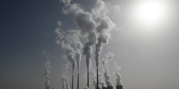 This picture shows the coal-powered Datang International Zhangjiakou Power Station in Zhangjiakou, one of the host cities for the 2022 Winter Olympics, in China's northern Hebei province on November 15, 2021. (Photo by GREG BAKER / AFP)