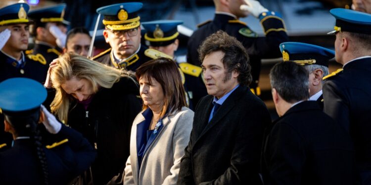 Argentine President Javier Milei (2nd-R), Minister of Economy Patricia Bullrich (3rd-L), and General Secretary of the Presidency Karina Milei (2nd-L) arrive at the commemoration event for the fallen Argentine Federal Police officers in Buenos Aires on July 2, 2024. (Photo by Tomas CUESTA / AFP)