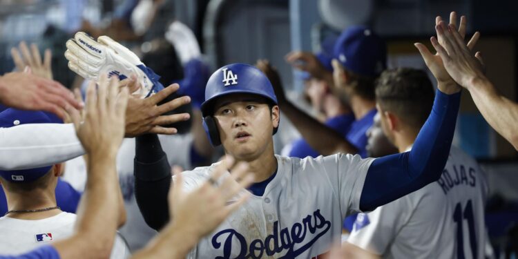 Inglewood (United States), 10/09/2024.- Los Angeles Dodgers designated hitter Shohei Ohtani is greeted by teammates after scoring during the seventh inning of the Major League Baseball (MLB) game between the Chicago Cubs and the Los Angeles Dodgers in Los Angeles, California, USA, 09 September 2024. EFE/EPA/CAROLINE BREHMAN