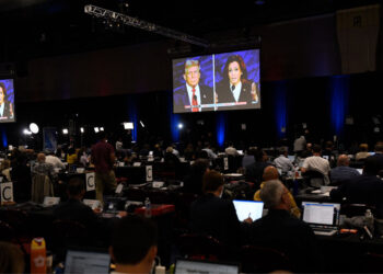 Journalists and members of the media watch from the spin room as US Vice President and Democratic presidential candidate Kamala Harris and former US President and Republican presidential candidate Donald Trump participate in a presidential debate at the National Constitution Center in Philadelphia, Pennsylvania, on September 10, 2024. (Photo by MATTHEW HATCHER / AFP) (Photo by MATTHEW HATCHER/AFP via Getty Images)