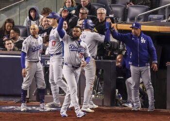 New York (United States), 28/10/2024.- The Dodgers dugout celebrates an RBI single by teammate Enrique Hernandez during the sixth inning of game three of the Major League Baseball (MLB) World Series between the American League Champion New York Yankees and the National League Champion Los Angeles Dodgers at Yankees Stadium in the Bronx borough of New York, New York, USA, 28 October 2024. The World Series is the best-of-seven games. (Nueva York) EFE/EPA/SARAH YENESEL