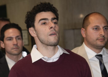 Luigi Mangione is escorted into Manhattan Criminal court for his arraignment on state murder and terror charges in the killing of UnitedHealthcare CEO Brian Thompson, Monday, Dec. 23, 2024, in New York. (AP Photo/Seth Wenig)