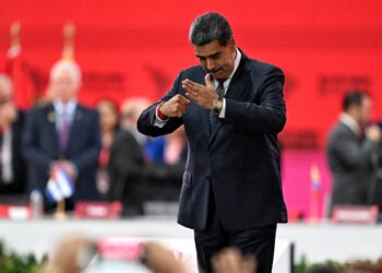 Venezuela's President Nicolas Maduro gestures during the opening session of the XXIV ALBA-TCP Summit in Caracas on December 14, 2024. - The Bolivarian Alliance for the Peoples of Our America (ALBA) celebrates its 20th anniversary in a regional context where its influence is increasingly diminishing. The summit, originally planned in Havana where the founding document was signed, was moved to the Venezuelan capital at the peak of an economic crisis that is hitting Cuba. (Photo by Juan BARRETO / AFP)