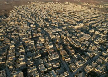 An aerial view shows the town of Saraqib in the eastern part of the Idlib province in northwestern Syria on December 1, 2024. - Government forces lost control of Syria's second city Aleppo on on December 1, for the first time since the country's civil conflict began, the Syrian Observatory for Human Rights said, after a lightning offensive dealt a severe blow to President Bashar al-Assad. (Photo by Aaref WATAD / AFP)