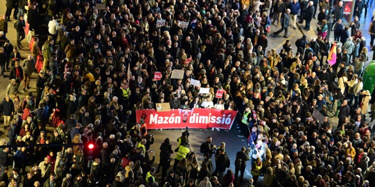 Protesters march to demand resignation of Valencian regional president Carlos Mazon over his handling of October floods, in Valencia on December 29, 2024. - The floods that started on October 29, 2024 in Valencia region killed 231 people, with thousands of victims now spending Christmas without loved ones, homes or property. (Photo by JOSE JORDAN / AFP)