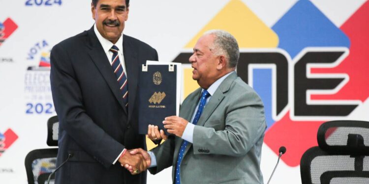 Venezuelan President Nicolas Maduro (L) shakes hands with Elvis Amoroso, president of National Electoral Council, in Caracas, Venezuela, July 29, 2024. Venezuela’s National Electoral Council on Monday declared Nicolas Maduro the winner of Sunday’s presidential elections. (Presidency of Venezuela/Handout via Xinhua) (Photo by Xinhua/Sipa USA) Xinhua Xinhua/Sipa USA