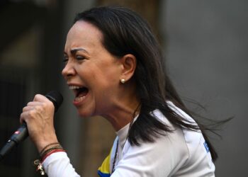 Venezuelan opposition leader Maria Corina Machado gives a speech during a protest called by the opposition on the eve of the presidential inauguration, in Caracas on January 9, 2025. Venezuela is on tenterhooks facing demonstrations called by both the opposition and government supporters. Machado emerged from hiding to lead protests in Caracas against the swearing-in of Nicolas Maduro for a highly controversial third term as president. (Photo by Federico PARRA / AFP)