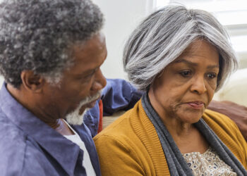 Loving African American couple being consoling each other at home