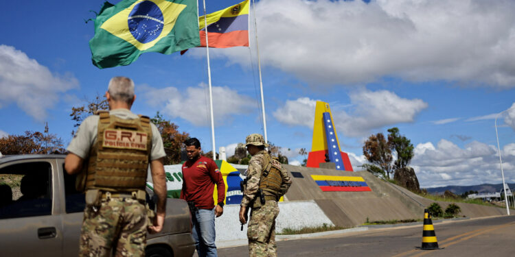 Brazilian police inspect cars at the Brazil-Venezuela border in the Brazilian city of Pacaraima, Roraima state, Brazil December 8, 2023. REUTERS/Ueslei Marcelino