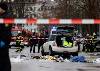 Members of the emergency services work at the scene where a car drove into a crowd in the southern German city of Munich on February 13, 2025 leaving several people injured, police said. Munich police said on social media platform X that "several people were injured" after "a car drove into a group of people" in the centre of the Bavarian state capital. (Photo by Michaela STACHE / AFP)