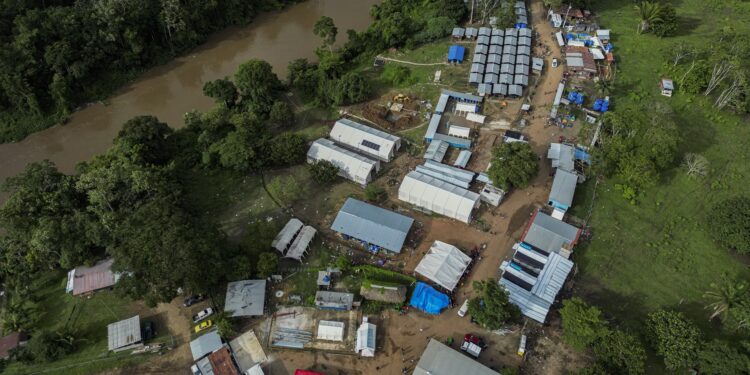 (FILES) Aerial view of the Reception Center for Migrant Care in Lajas Blancas, in the jungle province of Darien, Panama on June 27, 2024. Panama will close several shelters to care for migrants following the plummeting flow of migrants to the United States and will deport anyone entering the country through the inhospitable Darien jungle, the government said on March 7, 2025. (Photo by MARTIN BERNETTI / AFP)